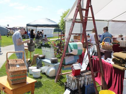 Shopper looking at antiques at the Shipshewana Antique & Vintage Market Festival